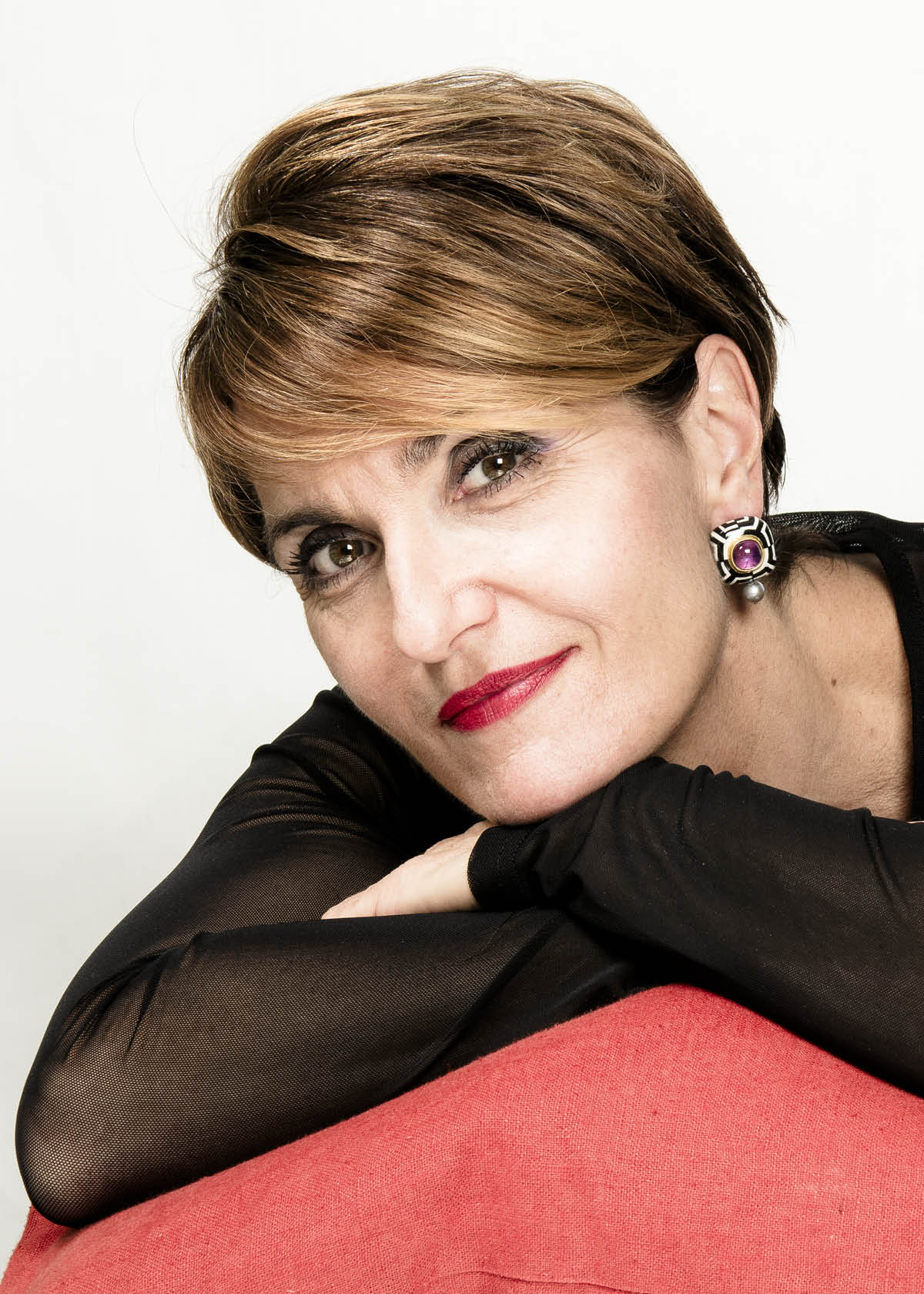 joyful model wearing luxury black and white earrings bartellone