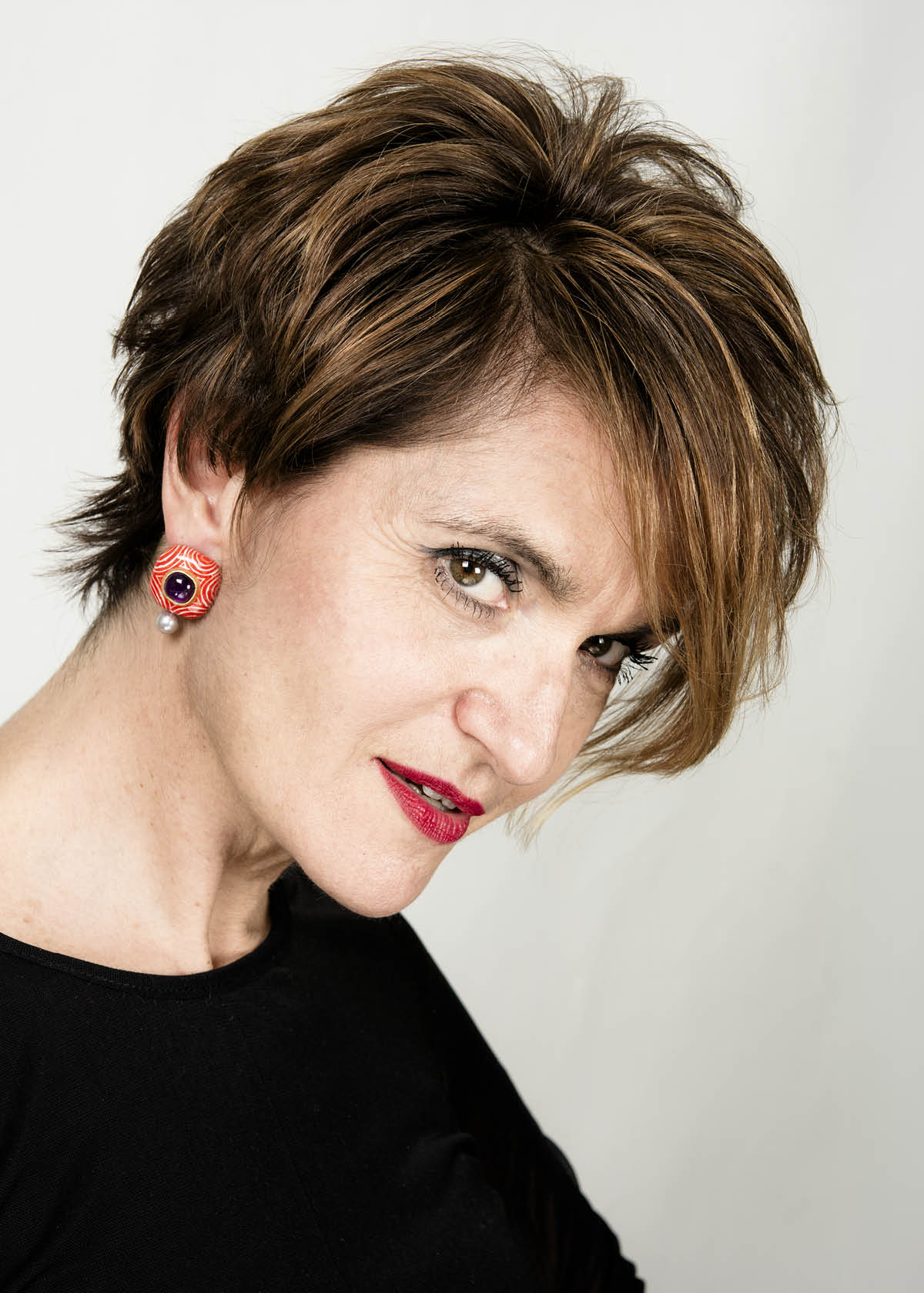model wearing luxury red italian jewelry earrings hypno gian luca bartellone